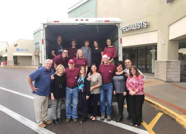 Real Estate Agents and staff members collecting goods for Metropolitan Ministries