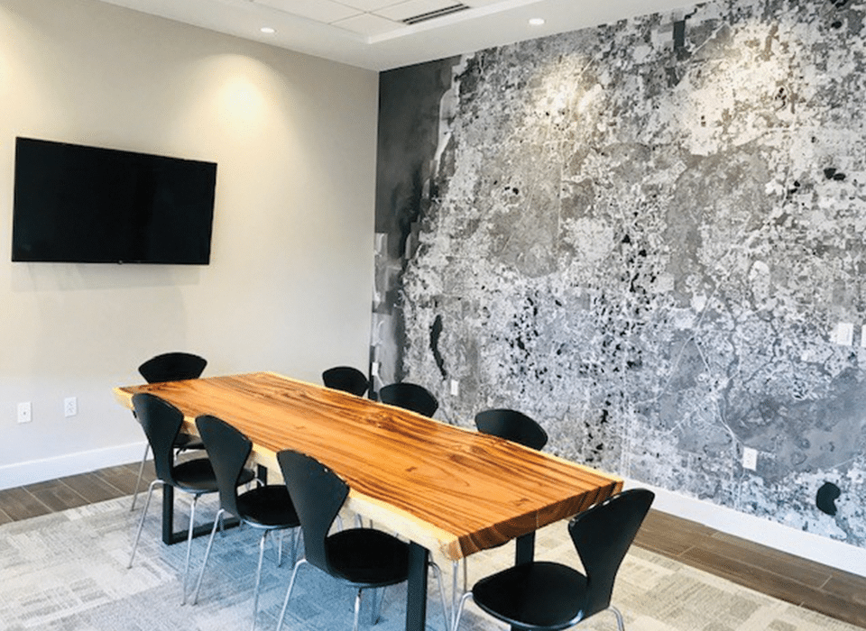 real estate conference room with wooden table and chairs