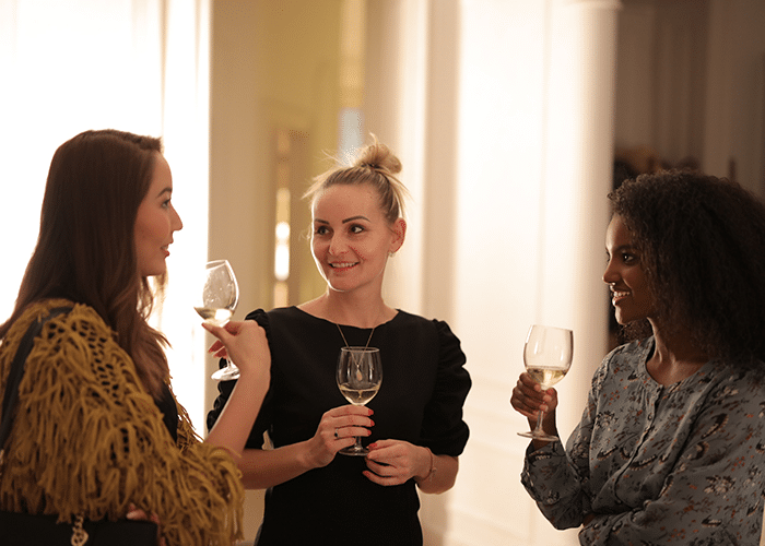 group of women drinking wine
