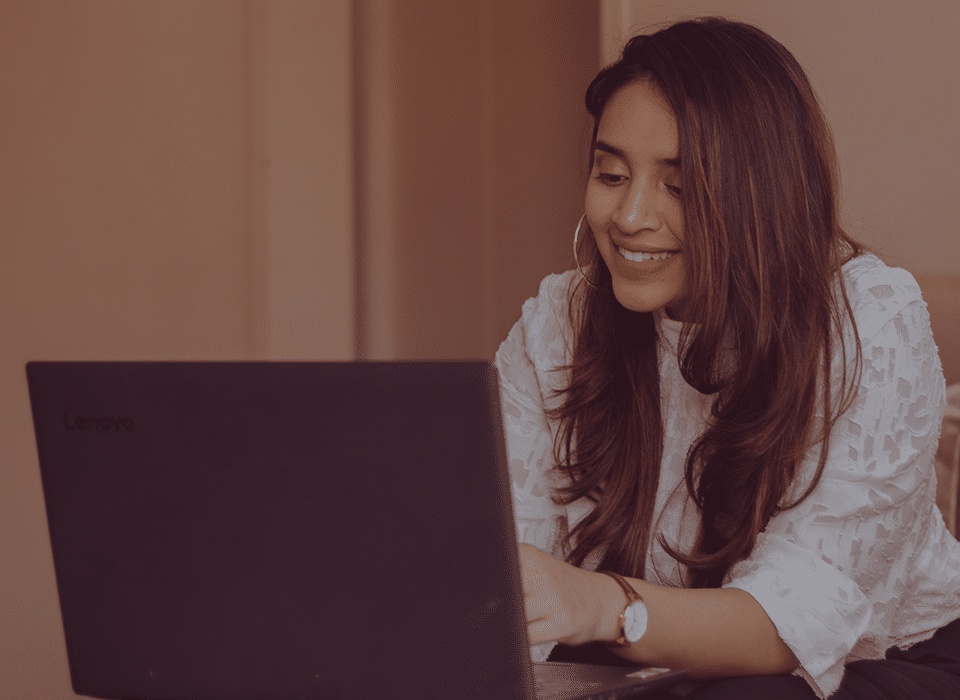 spanish young woman on laptop sending email for more information