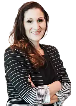 Market President Solidea Pitruzzello standing with arms crossed and smiling