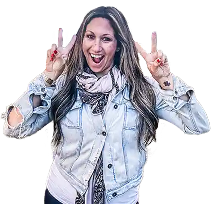 Market President, Joy Guttenberg smiling with hands posed in peace symbols.