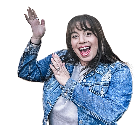 Mia Annibale, Brandon Market President, smiling and pointing up with her hands.